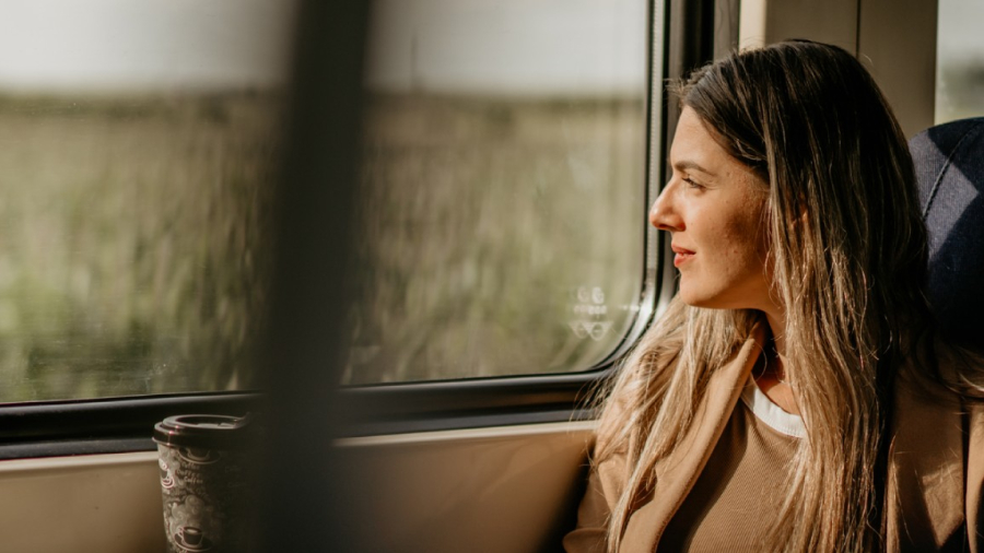 Woman smiling on train